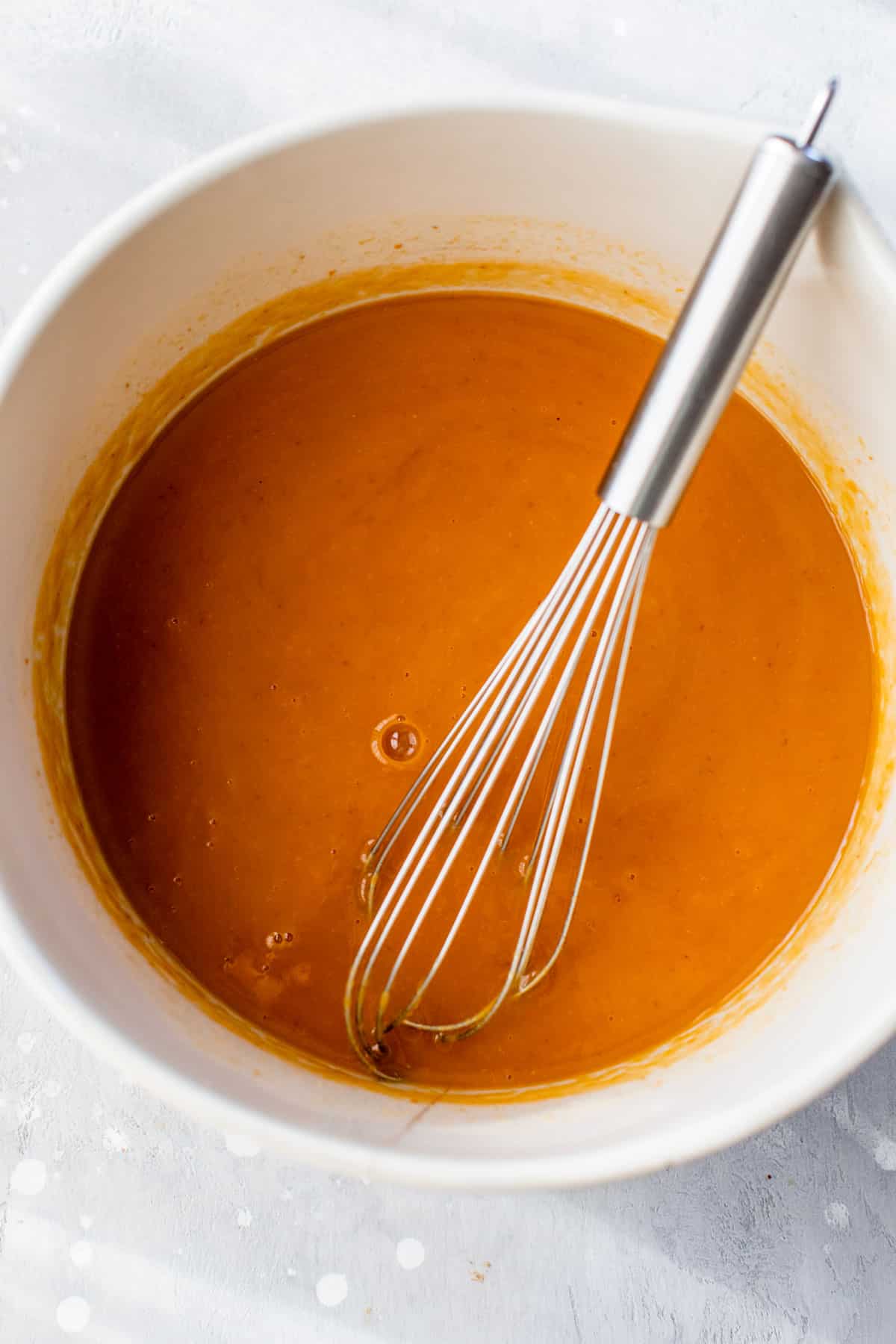wet ingredients whisked together in a bowl