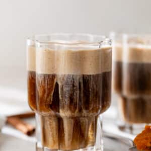 side view of a glass of pumpkin cream cold brew.