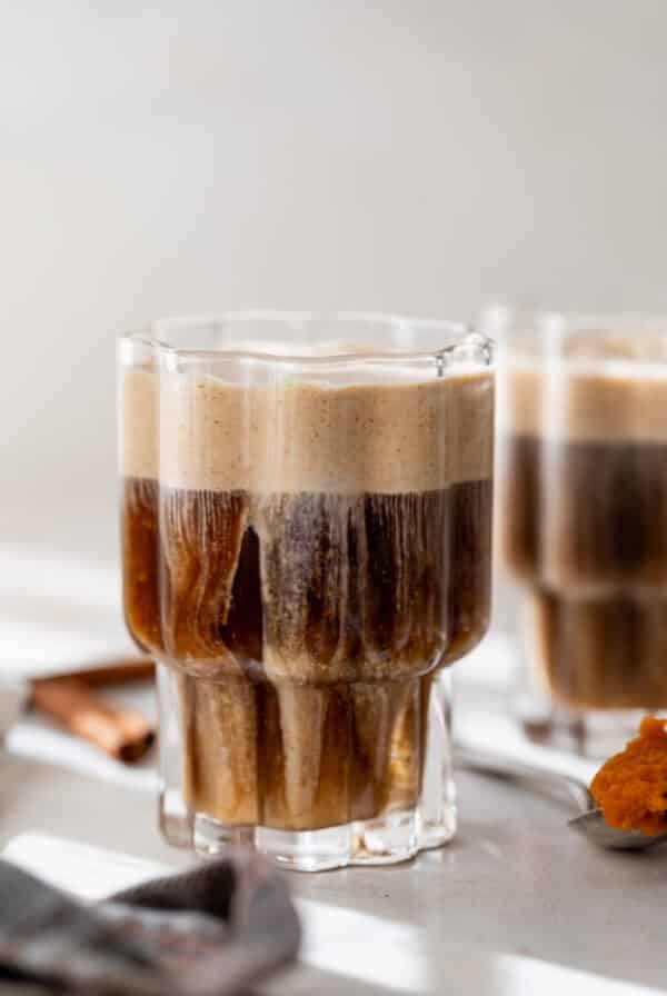 side view of a glass of pumpkin cream cold brew.