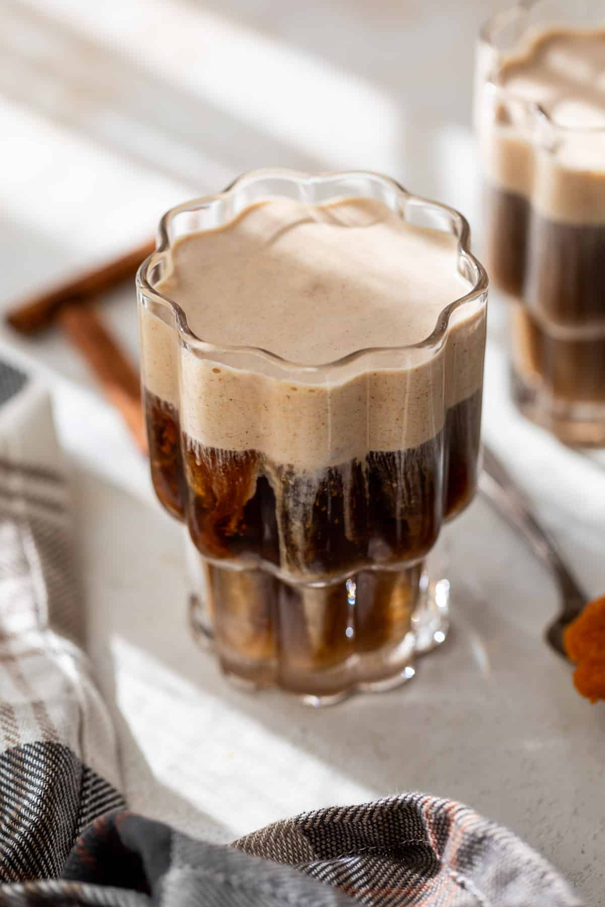 side view of a glass of pumpkin cream cold brew.
