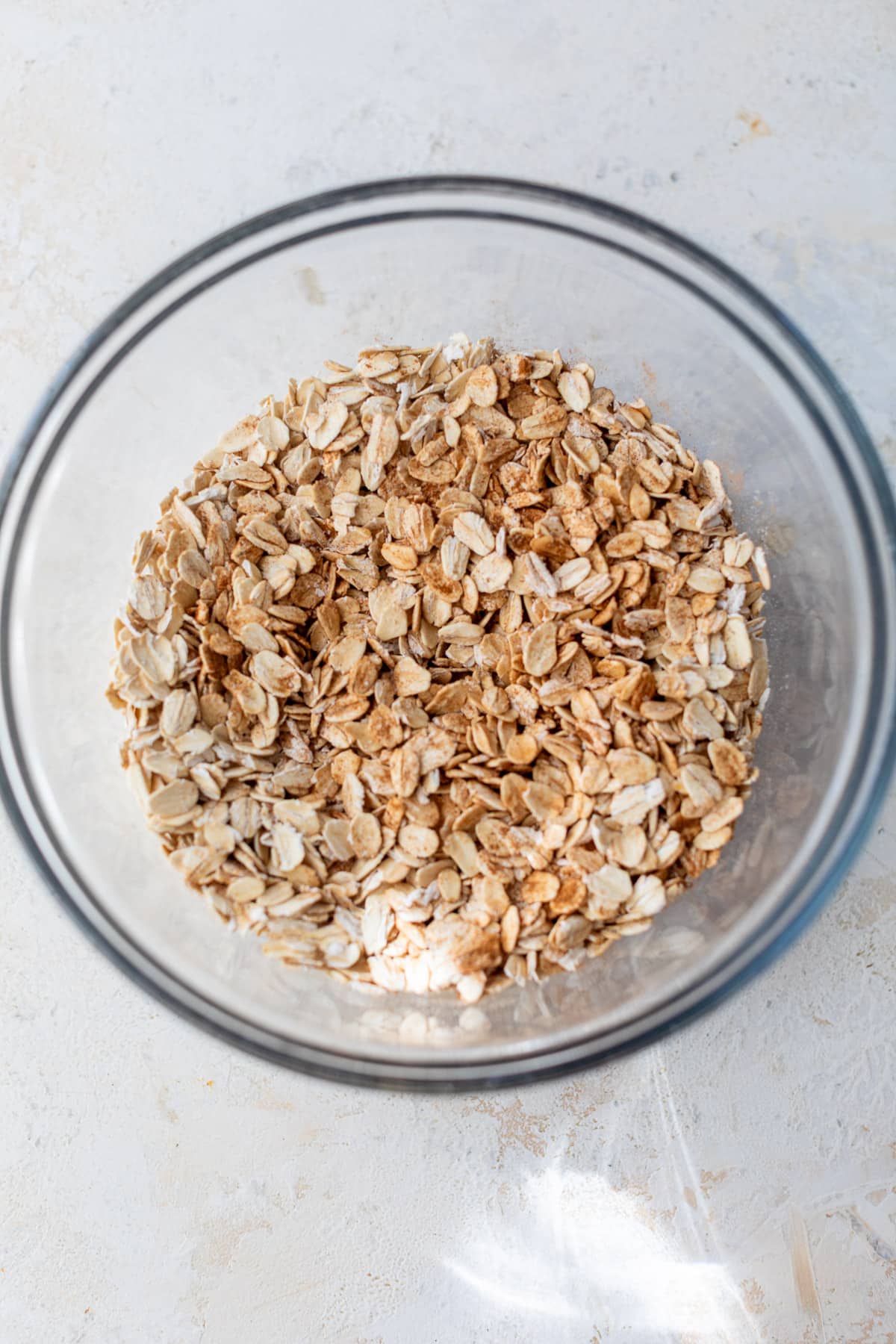 overhead view of oats in a large glass bowl.