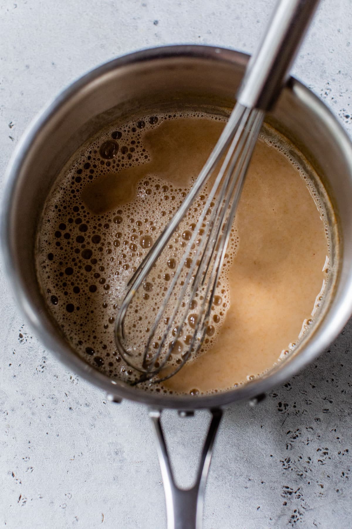 all ingredients in a saucepan with a whisk
