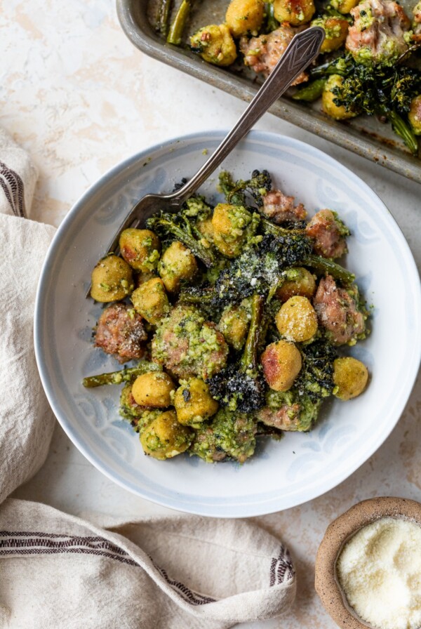 sheet pan gnocchi in a bowl with a fork