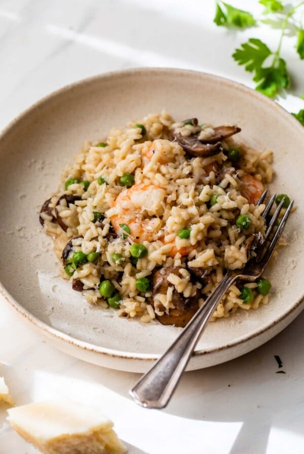 shrimp risotto in a bowl with a fork