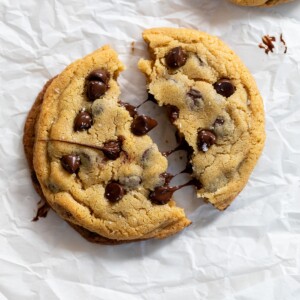 a single serve cookie split in half on parchment paper