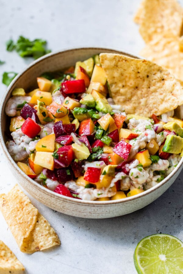 stone fruit ceviche in a bowl with tortilla chip