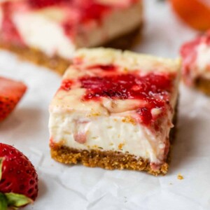 cheesecake in the shape of a bar on parchment paper