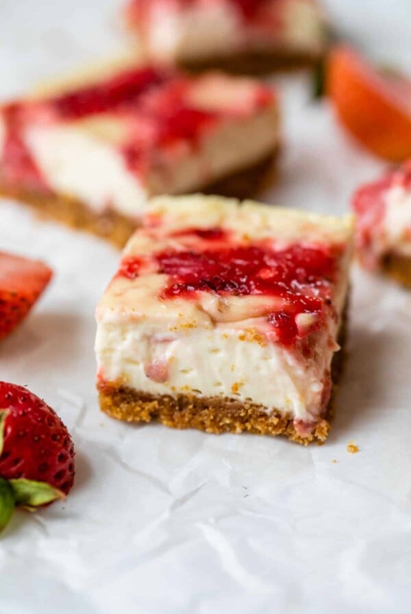 cheesecake in the shape of a bar on parchment paper