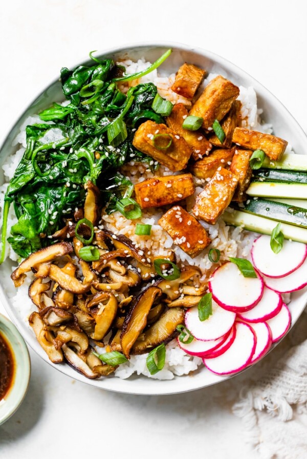 a large bowl of bibimbap made with tofu instead of beef