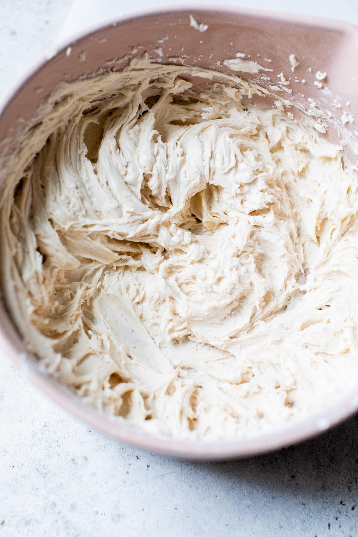 whipped buttercream in a pink bowl
