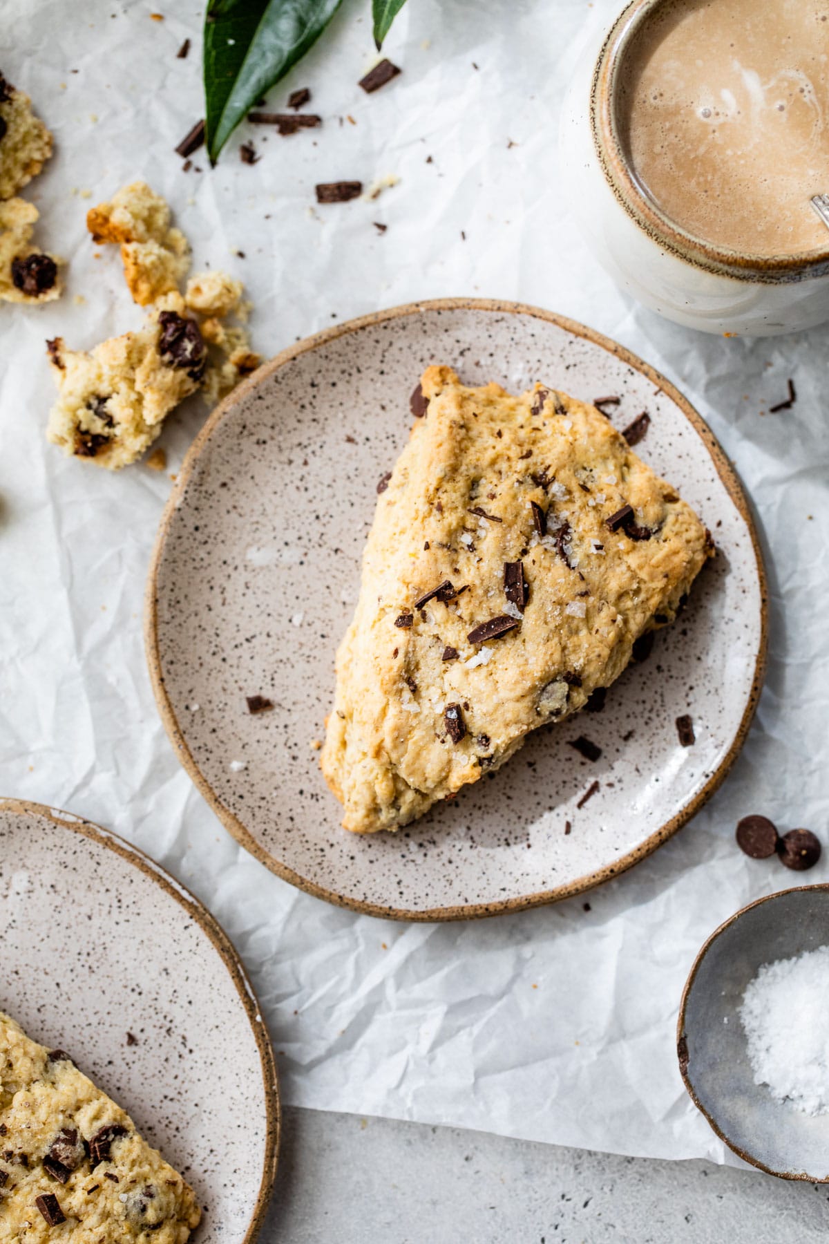 vegan scone on a plate next to a mug of coffee