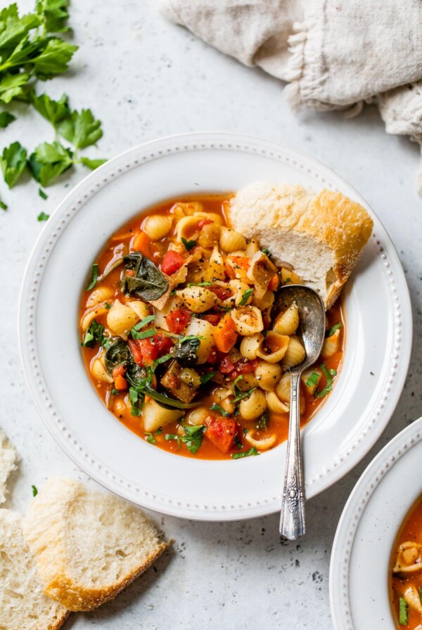 bowl of soup with a side of bread