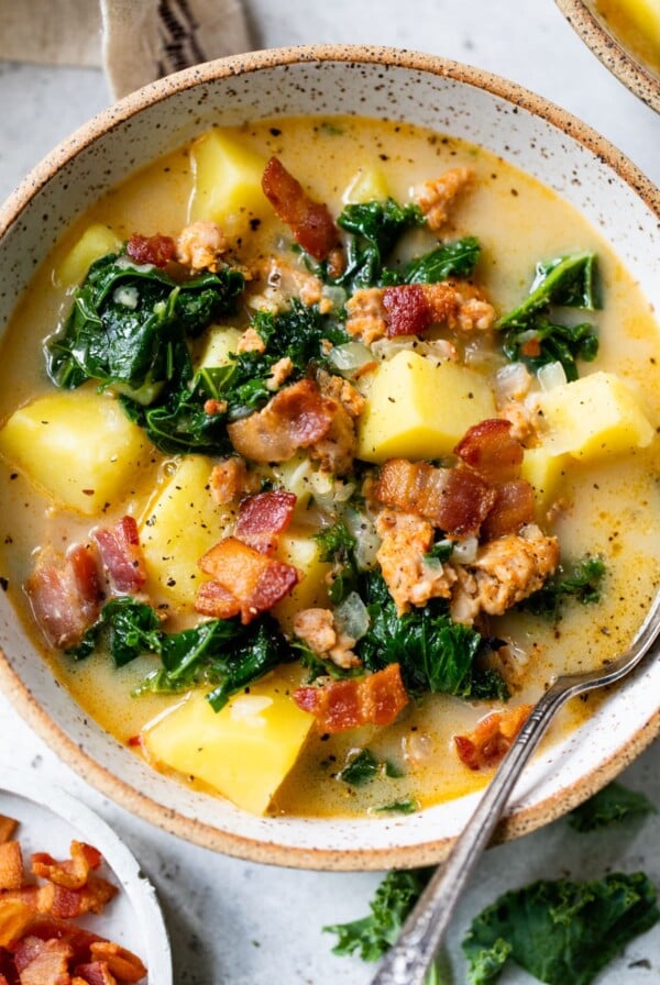 zuppa toscana in a bowl with a spoon