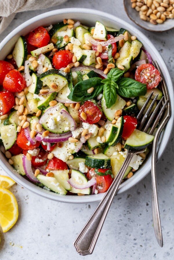 zucchini salad in a bowl with a fork